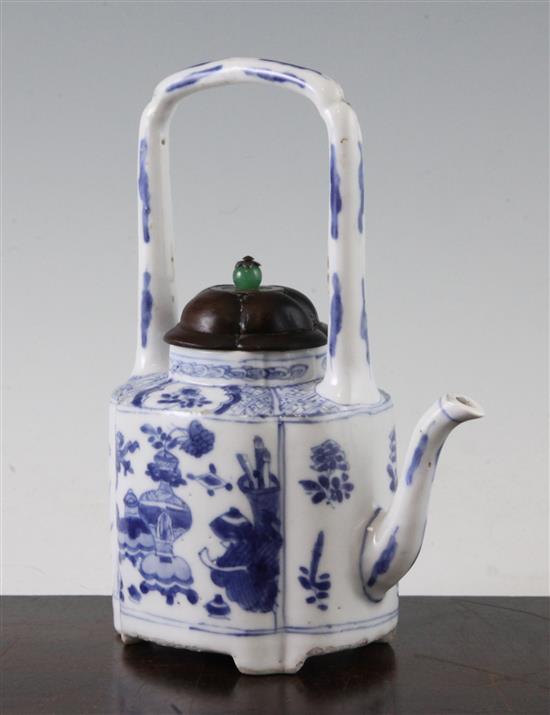 A Chinese blue and white wine pot, Kangxi period, 19cm, restorations